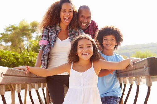 Smiling family, patients of Shady Grove Dental Care in Rockville, MD